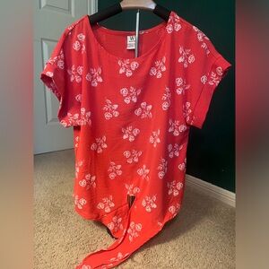 Nice polyester blouse with tie front. Washed but not worn.